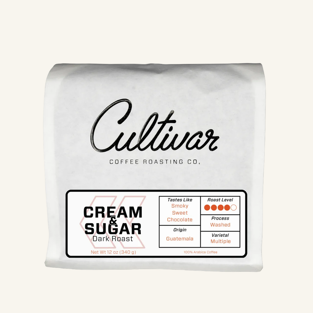 Retail bag of Cultivar Coffee Roasting Co.'s Cream & Sugar Dark Roast freshly roasted coffee beans